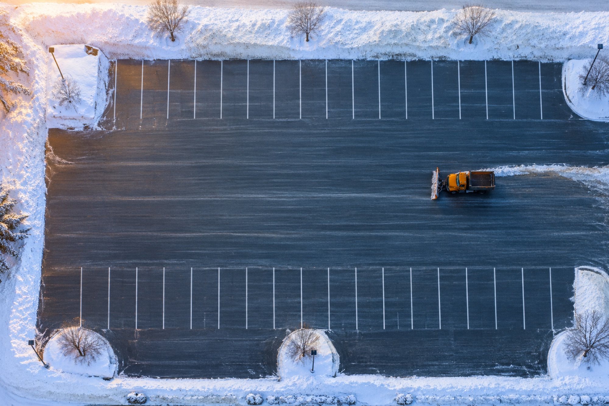 Aerial view of a freshly plowed parking lot